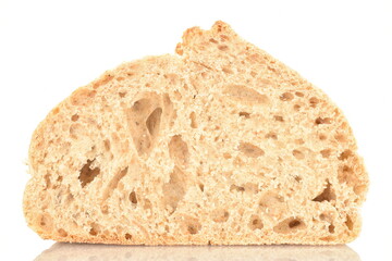 One half of a fragrant loaf without yeast with bran flakes, close-up, isolated on white.