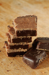 Stacked pieces of chocolate Candy closeup. Shallow depth of field