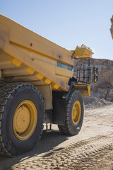 Brand new mining tractor working in open pit mining © Cavan