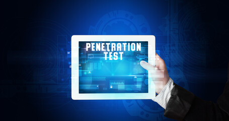 Young business person working on tablet and shows the digital sign: PENETRATION TEST