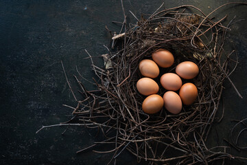 organic chicken eggs in  nest are one of the food ingredients on the restaurant table in the...