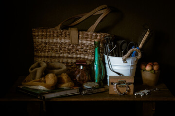 #37 Woven abaca bag, a white bucket,  a pair of baby shoes, and some bric-a-brac