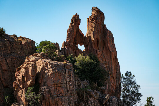 Heart shaped hole in a rock formation in the bizzare landscape of Calanche de Piana, located in n the Gulf of Porto, on the west coast of Corsica, France