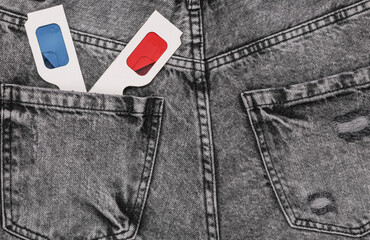 Retro 3d glasses in back pocket of gray jeans