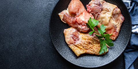 pieces of raw chicken, rooster or goose fresh farm meat ready to eat on the table for healthy meal snack outdoor top view copy space for text food background image rustic keto or paleo diet
