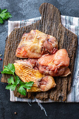 pieces of raw chicken, rooster or goose fresh farm meat ready to eat on the table for healthy meal snack outdoor top view copy space for text food background image rustic keto or paleo diet