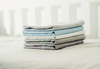 a set of clean and plain linens on the bed close-up