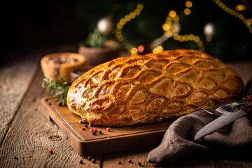 Perfect homemade juicy Beef Wellington, tenderloin dish on rustic wooden table