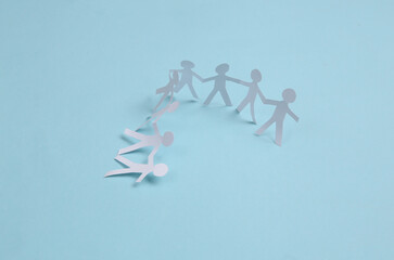 Paper cut chain of people on blue background