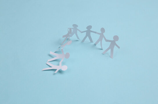 Paper Cut Chain Of People On Blue Background