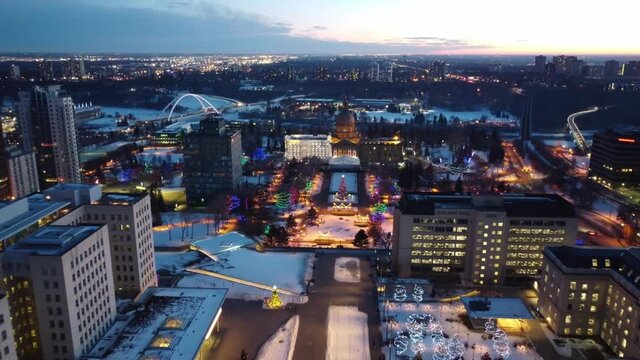 4k Aerial Twilight Evening panout away from Governemnt Buildings at the Capital City of Edmonton Alberta Canada during the decorative holiday season of the COVID19 pandemic with hardly any people 4-5