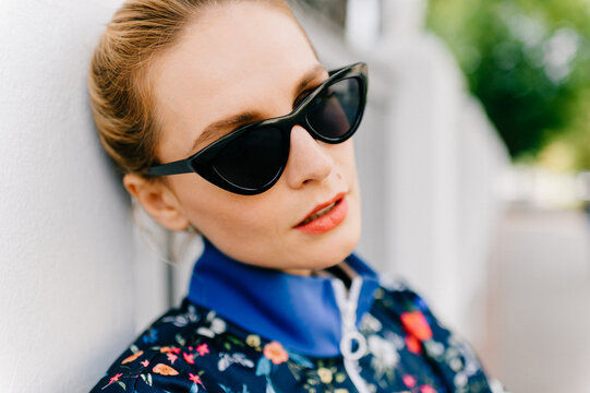 Portrait of beautiful young blond model with sunglasses