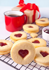Heart shaped traditional linzer cookies with strawberry jam. Valentine s day concept.