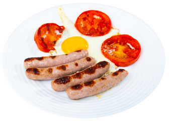 Close up of fried sunny-side-up eggs with sausages and tomatoes at plate. Isolated over white background