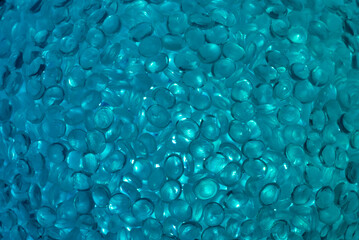 Abstract background in turquoise color. Backlit plastic ball, closeup. Taken with macro lens 105mm.
