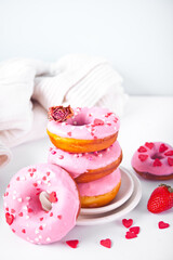 Stack of pink doughnuts on the plate. Valentine's Day concept.