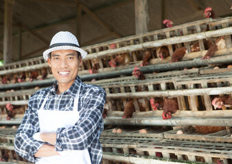 Farmer in  chicken farm