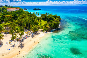 Aerial drone view of the beautiful small island and palm trees of Atlantic Ocean. Cayo Levantado island, Samana, Dominican Republic
