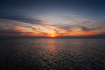 Romantic sunset over the Baltic Sea, orange vivid colors, beautiful sky, Krynica Morska