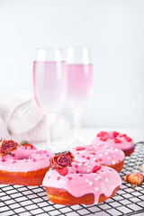 Pink doughnuts on the baking rack. Valentine's Day concept.