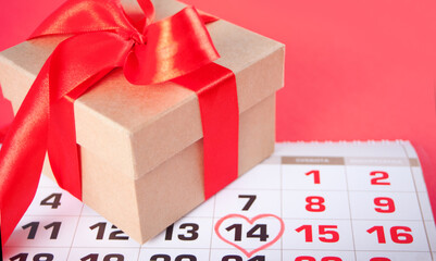 Date of February 14 on the calendar with gift box. Valentine s day concept.
