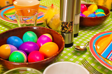 Fototapeta na wymiar Colorful Easter table with painted eggs