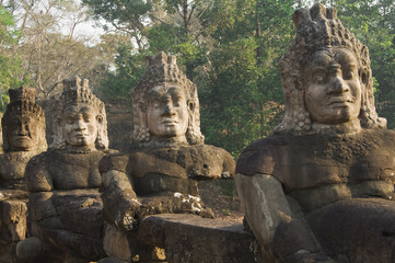 Fototapeta na wymiar Row of demons flanking the causeway leading to the South entrance, Angkor Thom, Siem Reap, Cambodia, Asia