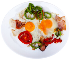 scrambled eggs with bacon for english traditional breakfast. Isolated over white background