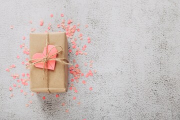Happy Valentine's Day photography with gift box and paper origami heart on wooden background....