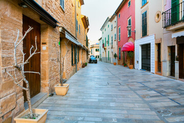 Narrow street with residential houses . Spanish pedestrian street with showcases and homes  