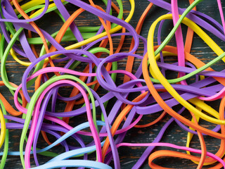 A tangled mess of colourful elastic bands