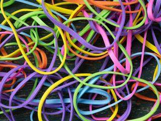 A tangled mess of colourful elastic bands