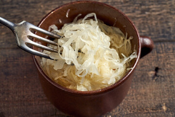 Taking fermented cabbage with a fork