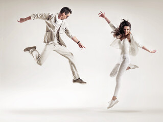 Two attractive dancers perforimg the dance show