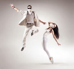 Two talented dancers wearing hygienic masks