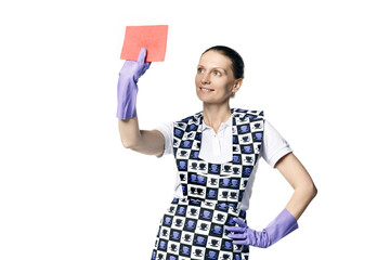 A beautiful young woman in the uniform of a maid holds a rag for washing windows. Isolated on a white background. Washes glass