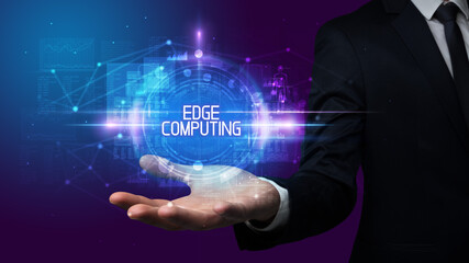 Man hand holding EDGE COMPUTING inscription, technology concept