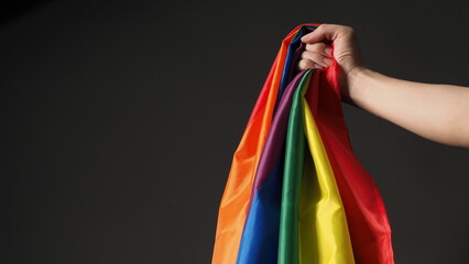 LGBTQ flag or Lesbian Gay Bi sexsual Transgender Queer or homosexsual pride Rainbow flag on black...