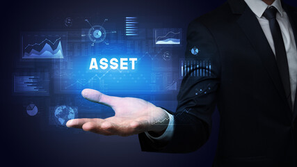 Hand of Businessman holding ASSET inscription, business success concept