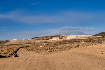 Fototapeta na wymiar Road leading to Large mining tailings in the Northern Nevada desert