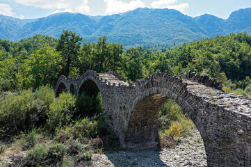 Fototapeta na wymiar View of the traditional stone Kalouta Bridge in Epirus, Greece.