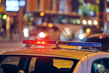Police car lights at night city street