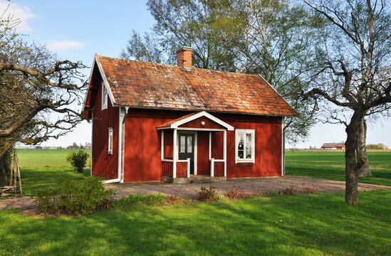 Red picturesque cottage in spring