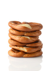 stack of soft pretzels on white