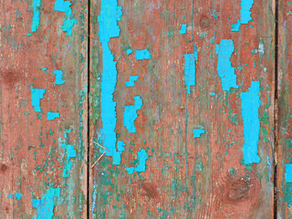 old wooden door with peeling blue paint