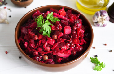 Traditional Russian salad with beets. The vinaigrette. Root vegetable salad.