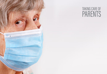 Old woman in medical mask isolated on white background