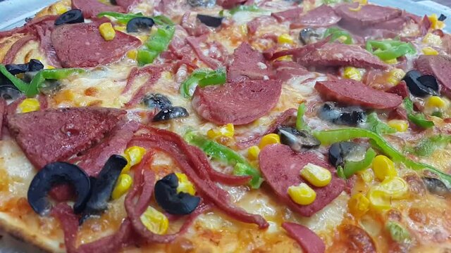 Sausage and veggie pizza with hot dogs