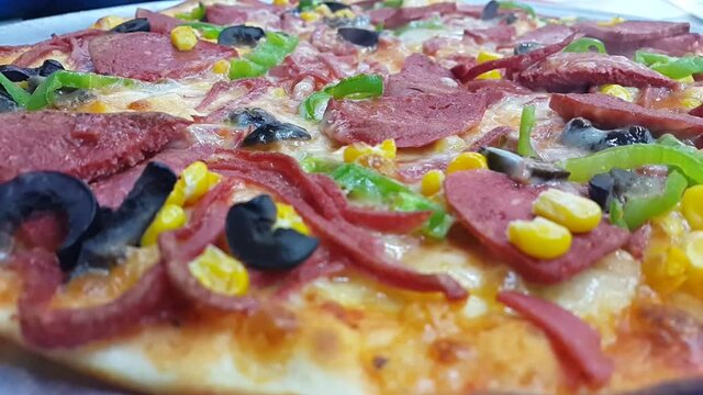 Sausage and veggie pizza with hot dogs