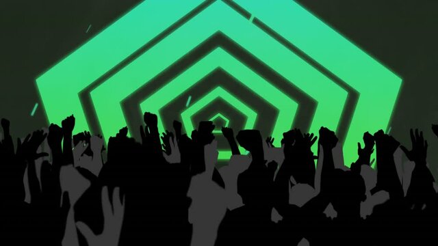 Silhouetted crowd raising hands in the air with green hexagons and moving lights behind